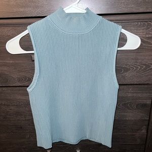 Elegant blue/green no sleeve shirt. Worn once, new condition.